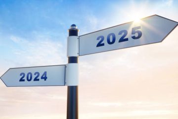 Signpost over sunny evening sky with the numbers year 2024 and 2025